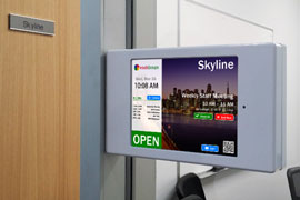 Room display hardware mounted outside a room